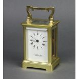 Wellington, a 20th Century English 8 day carriage clock with enamelled dial and Roman numerals