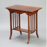 An Edwardian Liberty style rectangular mahogany occasional table with under tier, raised on shaped