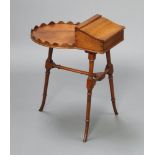 A Georgian style oval shaped smokers table incorporating a box with hinged lid, raised on turned