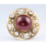A yellow metal cabochon cut garnet and 4 stone moonstone brooch, 4.5cm, 20 grams grossThere is