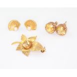 A 9ct yellow gold leaf brooch set with a citrine, 2 pairs of gem set earrings, gross weight 6.3