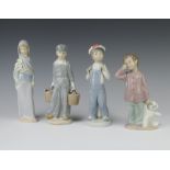 Three Lladro figures - standing girl with lilies 23cm (chips to flowers), standing boy wearing