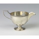 A silver pedestal cream jug Sheffield 1933 124 grams