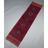 A blue and red ground Meshwani rug with 5 diamonds to the centre within a multi row border 247cm x