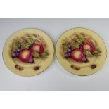 Aynsley, a pair of plates decorated peaches and grapes, 26.5cm signed D James