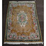 A yellow ground and floral patterned Chinese rug with central medallion 283cm x 186cm Some