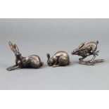 In the manner of Richard Cooper & Co., a bronze figure of a crouching rabbit, the back marked PJ 3cm