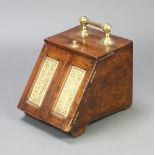 An Edwardian oak and brass banded coal box with patented hinged lid 30cm h x 30cm w x 41cm d Pitting