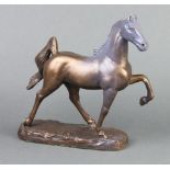 After M King, a bronze figure of a prancing horse, the base marked M King 1987 24cm x 20cm x 7cm