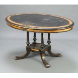 A Victorian walnut and ebonised oval Loo table raised on 4 turned and fluted columns with platform