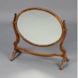 A 19th Century style oval plate dressing table mirror contained in a mahogany swing frame 50cm h x