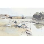 ** John Yardley born 1933, watercolour signed, harbour scene with beached boats and distant cargo