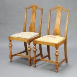 A pair of 1930's Queen Anne style walnut slat back bedroom chairs, the seats upholstered in Berlin