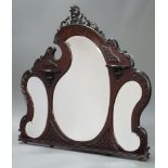 An Edwardian triple plate over mantel mirror fitted 3 shaped bevelled plate mirrors contained in a