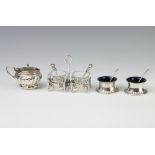 A Sterling silver cruet base, two salts, a mustard and four spoons, 116 gms