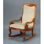 A Victorian mahogany show frame rocking chair upholstered in mushroom coloured material, 98cm h x