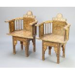 A pair of heavily inlaid mother of pearl Moorish armchairs with spindle decoration 88cm h x 61cm w x