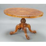 A Victorian quarter veneered figured walnut Loo table, raised on turned column and tripod base