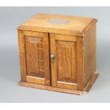 A Victorian oak stationery box with silver plaque to the lid, stepped interior, the base with 2