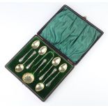 A set of silver lily pattern coffee spoons, nips and sifter spoon, Birmingham 1903, 58gms