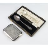 A silver octagonal cigarette case, London 1921, together with two silver spoons, gross weight