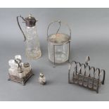 An Edwardian cut glass silver plated mounted ewer, a 7 bar toast rack and minor plated wares