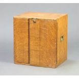 A Victorian light oak smokers/collectors cabinet with brass countersunk handles 33cm h x 30cm w x