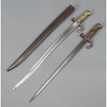 A French chassepot bayonet complete with scabbard, the back of the blade dated 1868 together with