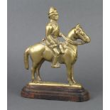 A 19th/20th Century brass and iron doorstop in form of a mounted cavalryman 25cm x 18cm x 6cm