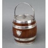 An Edwardian silver plated mounted oak biscuit barrel