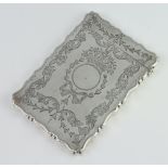 An Edwardian engraved silver card case with ribbon, swags and scrolls and vacant cartouche,