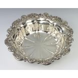 An Edwardian repousse silver bowl with floral rim, Birmingham 1904, 28cm, 454g