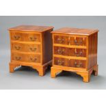 A pair of Georgian style yew bedside chests of serpentine outline with canted corners fitted 3