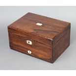 A Victorian rosewood and inlaid mother of pearl trinket box with hinged lid revealing a fitted