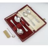 A pair of cased silver spoons London 1964, 3 others and a paperclip 80gms