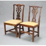 Two similar Georgian Chippendale style slat back mahogany dining chairs with upholstered seats