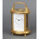 Garrard, a 20th Century 8 day carriage timepiece with enamelled dial and Roman numerals contained in