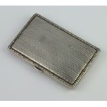 A 800 standard engine turned cigarette case, 60gms gross weight, 8cm