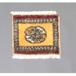 A yellow and black ground Mori Jaldar rug with central medallion and 3 row border 28cm x 30cm