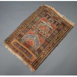 An orange and brown ground Afghan rug 128cm x 86cm