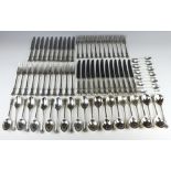 A silver canteen of fancy fiddle pattern cutlery comprising 12 coffee spoons, 12 dessert spoons,