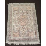 A North West Persian white ground silk rug with central medallion 181cm x 119cm