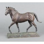 Franklin Mint, after Dr Robert Taylor, a bronze figure "Poised for Glory" a figure of a walking