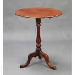 A Victorian oval shaped mahogany snap top wine table raised on a pillar and tripod base 68cm h x