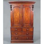 A Victorian mahogany linen press with moulded cornice, fitted 4 trays enclosed by panelled doors,