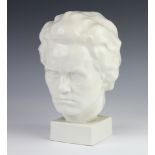 An Austrian white glazed bust of Beethoven on a square base 24cm