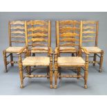 A set of 6 18th Century style elm Lancastrian ladder back dining chairs with woven rush seats
