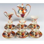 A Bursley Ware coffee set pattern 772 by Charlotte Rhead, decorated with fruits comprising