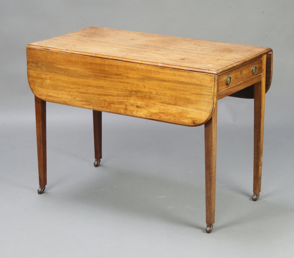 A Georgian bleached mahogany Pembroke table fitted a drawer, raised on square tapered supports,