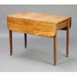 A Georgian bleached mahogany Pembroke table fitted a drawer, raised on square tapered supports,